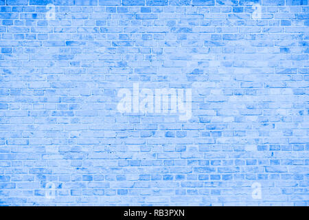 Simple grungy blue and white brick wall with light gray shades seamless pattern surface texture background. Stock Photo