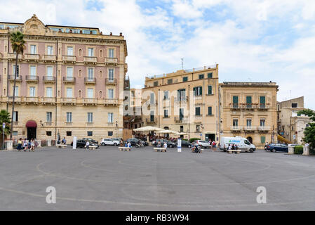 Syracuse, Sicily, Italy - August 23, 2017: View of the square at Largo Aretusa street near the Fountain of Arethusa on Ortygia Island Stock Photo