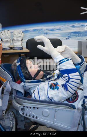 International Space Station Expedition 58 prime crew member Anne McClain of NASA, tests her spacesuit gloves during a Russian Sokol launch and entry suit pressure and leak check at the Integration Facility Baikonur Cosmodrome November 20, 2018 in Baikonur, Kazakhstan. McClain, David Saint-Jacques of the Canadian Space Agency and Oleg Kononenko of Roscosmos are expected to launch December 3rd on the Soyuz MS-11 spacecraft from the Cosmodrome in Kazakhstan for a six-and-a-half month mission on the International Space Station. Stock Photo