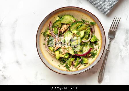 Delicious healthy bowl with tuna, cucmber and avocado salad. Top view Stock Photo
