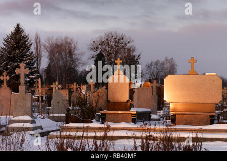 Cemetery with marble tombstone luminous on sunshine in evening time Stock Photo