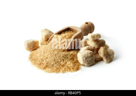Brown cane sugar crystals in wooden scoop isolated on white background Stock Photo