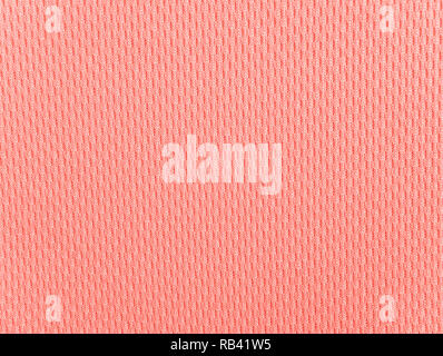 Coral polyester activewear knitted fabric texture. Color trend of the year 2019. Stock Photo