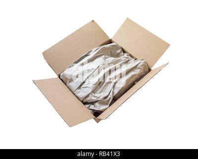 Opened postal package box full of goods covered by brown recycled wrapping paper isolated on white. Surprise gift delivery. Stock Photo