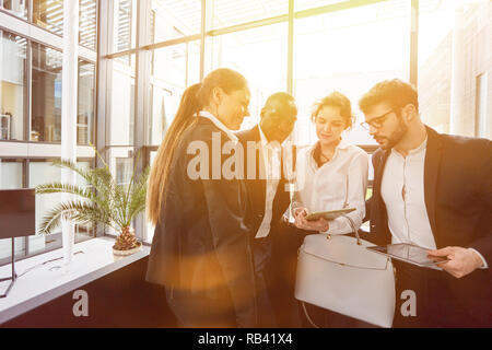 Group of Business People at Business Teamwork Meeting with Tablet Computer in Office Stock Photo