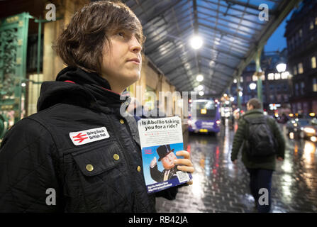 Ellie Harrison, a member of the Bring Back British Rail group, campaigns outside Glasgow's Central Station where she was joined by union members and TSSA volunteers calling for public ownership of railways. Stock Photo