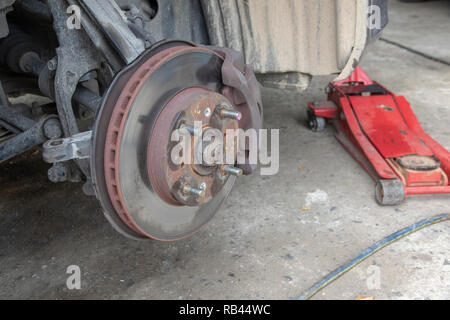 Close up detail disk break and suspension replacement on car. Stock Photo