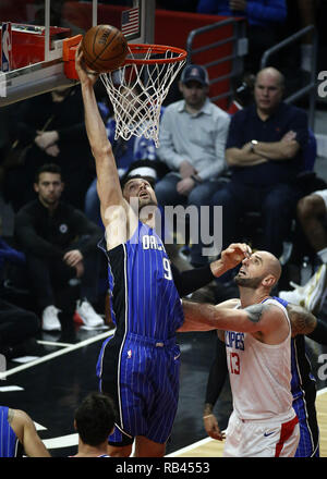 Los Angeles, California, USA. 6th Jan, 2019. Orlando Magic's Nikola Vucevic (9) goes to basket while defended by Los Angeles Clippers' Marcin Gortat (13) during an NBA basketball game between Los Angeles Clippers and Orlando Magic Sunday, Jan. 6, 2019, in Los Angeles. Credit: Ringo Chiu/ZUMA Wire/Alamy Live News Stock Photo
