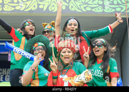 Bangladesh fans cheer on their team during the  ICC Cricket World Cup 2011 opening match against India at Sher-e-Bangla National Stadium in Dhaka, Ban Stock Photo