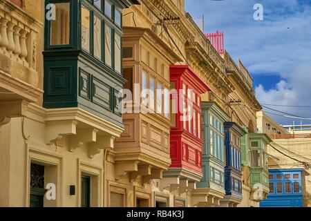 A row of traditional Maltese houses on the main island of Malta in the Mediterranean sea. A popular destination for tourists from around the world. Stock Photo