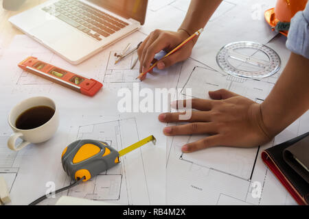 Architect or engineer working on blueprint in office, architectural concept Stock Photo