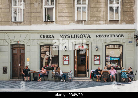 Prague, Czech Republic - August 23, 2018: People drinking beer at the outdoor tables of 'Myslikova ceska restaurace'('czech restaurant') in Prague. Be Stock Photo