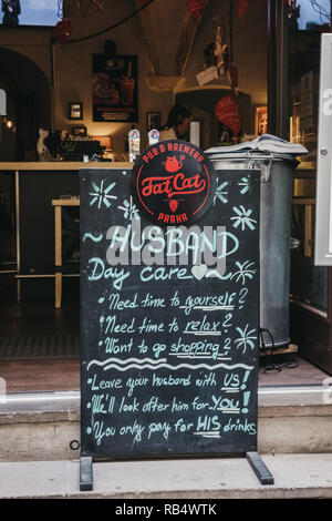 Prague, Czech Republic - August 23, 2018: Funny sign outside Fat Cat pub & brewery in Prague. Beer is a large part of Czech culture. Stock Photo