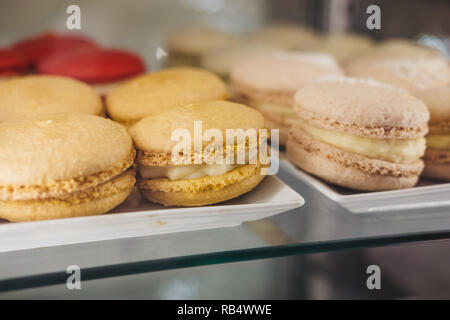 Close up of colourful macaroons on a plate. Stock Photo