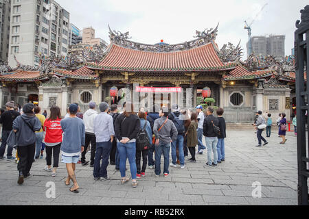 Taipei, Taiwan - November 22, 2018 : The most Longshan Temple in Taipei, Taiwan. This temple honors a mixture of both Buddhist and Taoist deities. Stock Photo