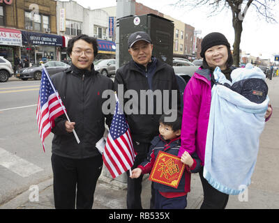 Chinese family attend Lion dance ceremony in the Bensonhurst section of Brooklyn on Chinese New Year, 2017. Stock Photo