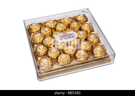 Box of Ferrero Rocher chocolates, in their plastic presentation box and gold wrappers. Stock Photo