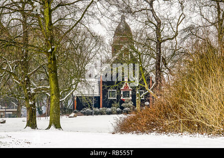 Rotterdam, The Netherlands, March 3, 2018: winter scene in The Park with the wooden building of the Norwegian Sailor's Church surrounded by snow-cover Stock Photo