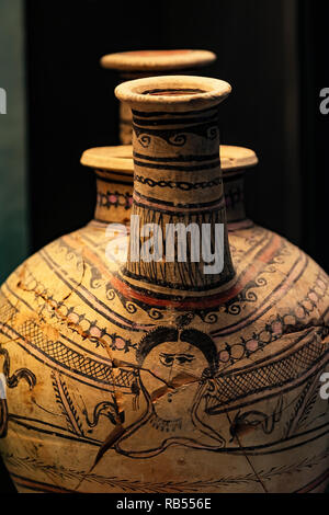 Italy Basilicata Melfi Castle National archeologic museum,Askos with three mouths in ceramic 'listata' decorated with male head Stock Photo