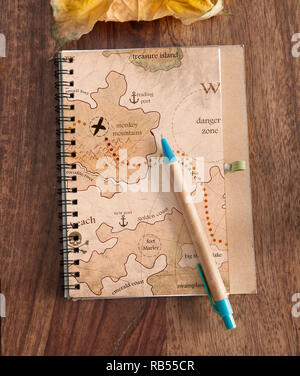 travel diary on wood table Stock Photo