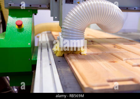 CNC woodworking wood processing machine, modern technology in the industry. Stock Photo