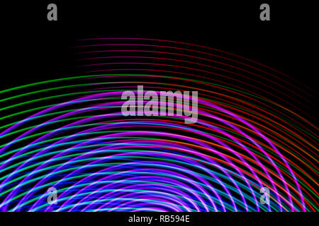 Colorful pink, purple and blue  neon  spiral lines.Abstract background of blue neon glowing light shapes. Bright stripes for poster, website, brochure Stock Photo