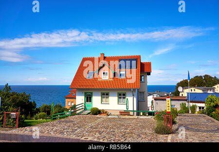 Holiday house with red roof tiles and solar panels. Living overlooking the Baltic Sea on the island of Rügen. Stock Photo