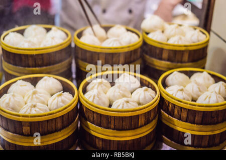 Street food booth selling Chinese specialty Steamed Dumplings in Beijing, China Stock Photo