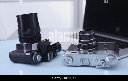 Computer keyboard, mouse and camera lie on table. Stock Photo