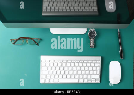Workplace with notebook laptop Comfortable work table in office windows and city view. Stock Photo