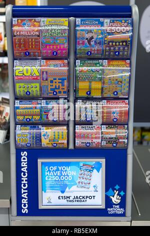 A National Lottery scratchcard retail display in a newsagent store in the UK. Stock Photo