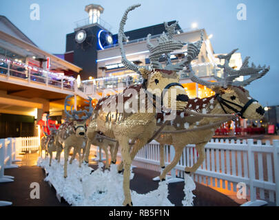 A Santa Sleigh with 8 reindeer made using 750,000 LEGO bricks at Tacoma Square, Mermaid Quay, Cardiff Bay. The models took 3 months, to build and will Stock Photo