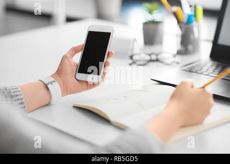 web designer working on smartphone user interface Stock Photo