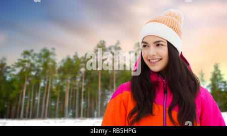 happy teenage girl in winter clothes outdoors Stock Photo