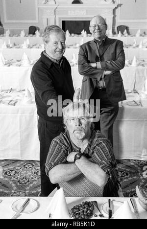 The Goodies classic comedy trio Tim Brooke-Taylor, Graeme Garden and Bill Oddie photographed at Simpsons in the Strand, London, England, United Kingdom. Stock Photo