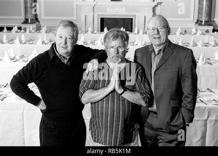 The Goodies classic comedy trio Tim Brooke-Taylor, Graeme Garden and Bill Oddie photographed at Simpsons in the Strand, London, England, United Kingdom. Stock Photo