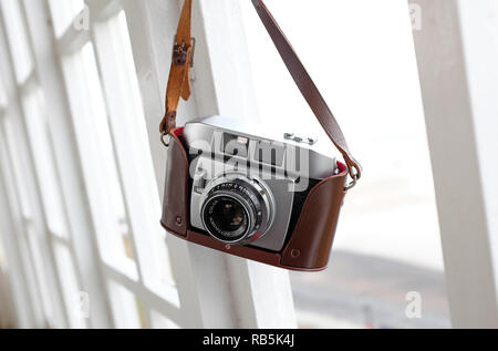 vintage retro 35mm film rangefinder camera in brown leather case Stock Photo