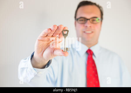 Business man with a key Stock Photo