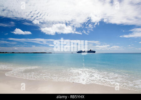 The view of a cruise ship drifting near uninhabited island Half Moon Cay (Bahamas). Stock Photo