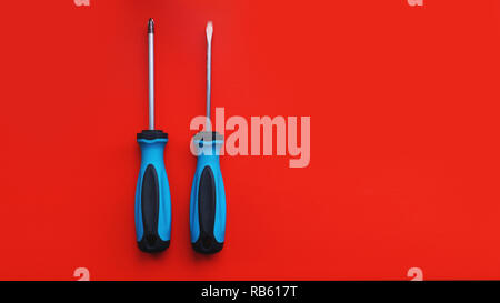 Screwdriver isolated on bright Background. Top View of Blue Handle Screwdriver Stock Photo