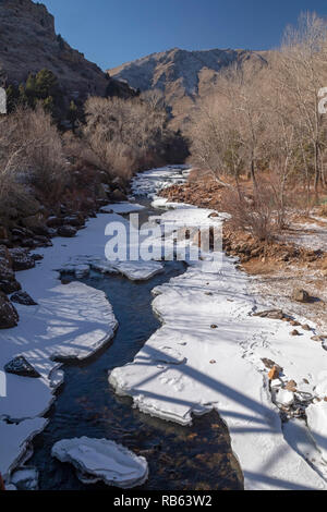 Golden Colorado - Clear Creek, partially frozen in winter. The creek flows from the Continental Divide in the Rocky Mountains through Clear Creek Cany Stock Photo