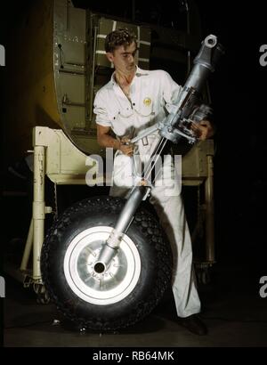 Colour photograph of a nose wheel and landing gear assembly for a B-25 bomber under construction in a western aircraft plant, North American Aviation, Inc., Calif. Dated 1942 Stock Photo