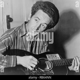 Portrait photograph of Woody Guthrie (Woodrow Wilson Guthrie) (1912-1967) American singer-songwriter. Dated 1943 Stock Photo