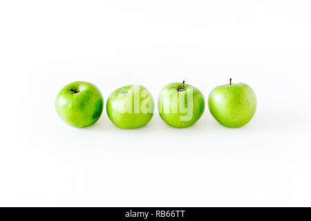 A group of four green Granny Smith apples isolated on a white background Stock Photo