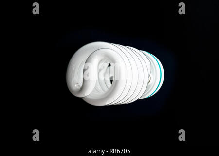 High power energy efficient high power fluorescent photographic light bulb on a black background Stock Photo
