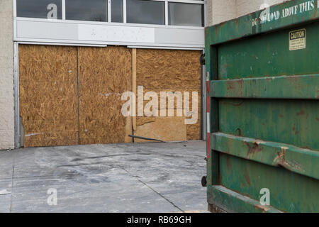 The outline of a logo sign outside of a closed Macy's retail store in Muncy, Pennsylvania, on December 30, 2018. Stock Photo