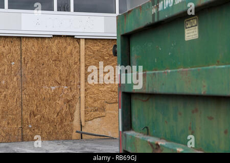 The outline of a logo sign outside of a closed Macy's retail store in Muncy, Pennsylvania, on December 30, 2018. Stock Photo