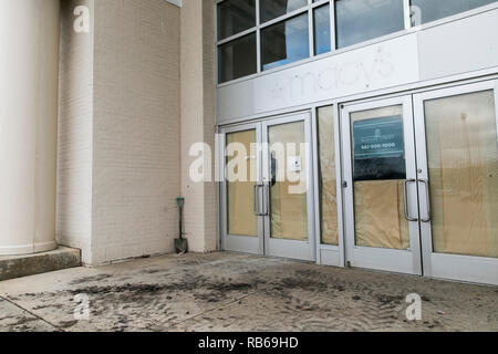 The outline of a logo sign outside of a closed Macy's retail store in Muncy, Pennsylvania, on December 30, 2018. Stock Photo