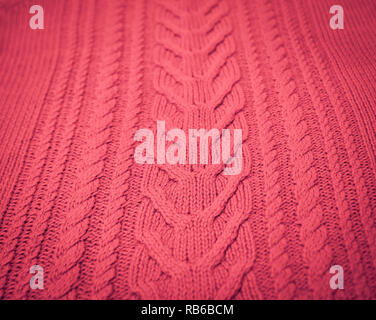 Pink Blush Terracotta Knitted pattern wool sweater texture close up. Handmade red knitting wool texture background Stock Photo