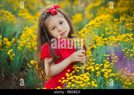 Young cute girl in red shirt and white 